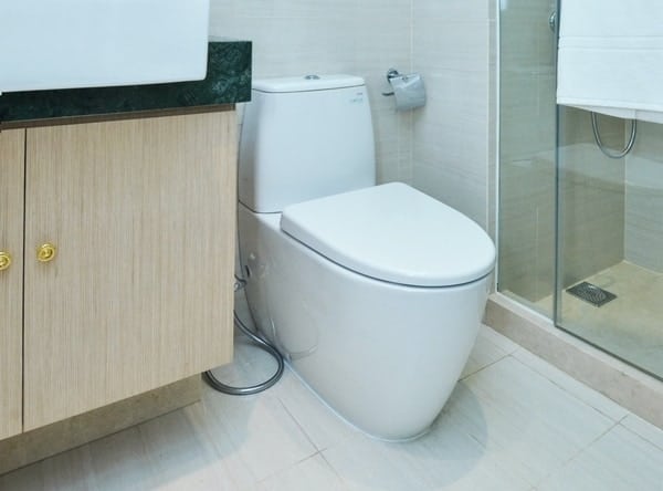 A skirted toilet ready for a bidet installation