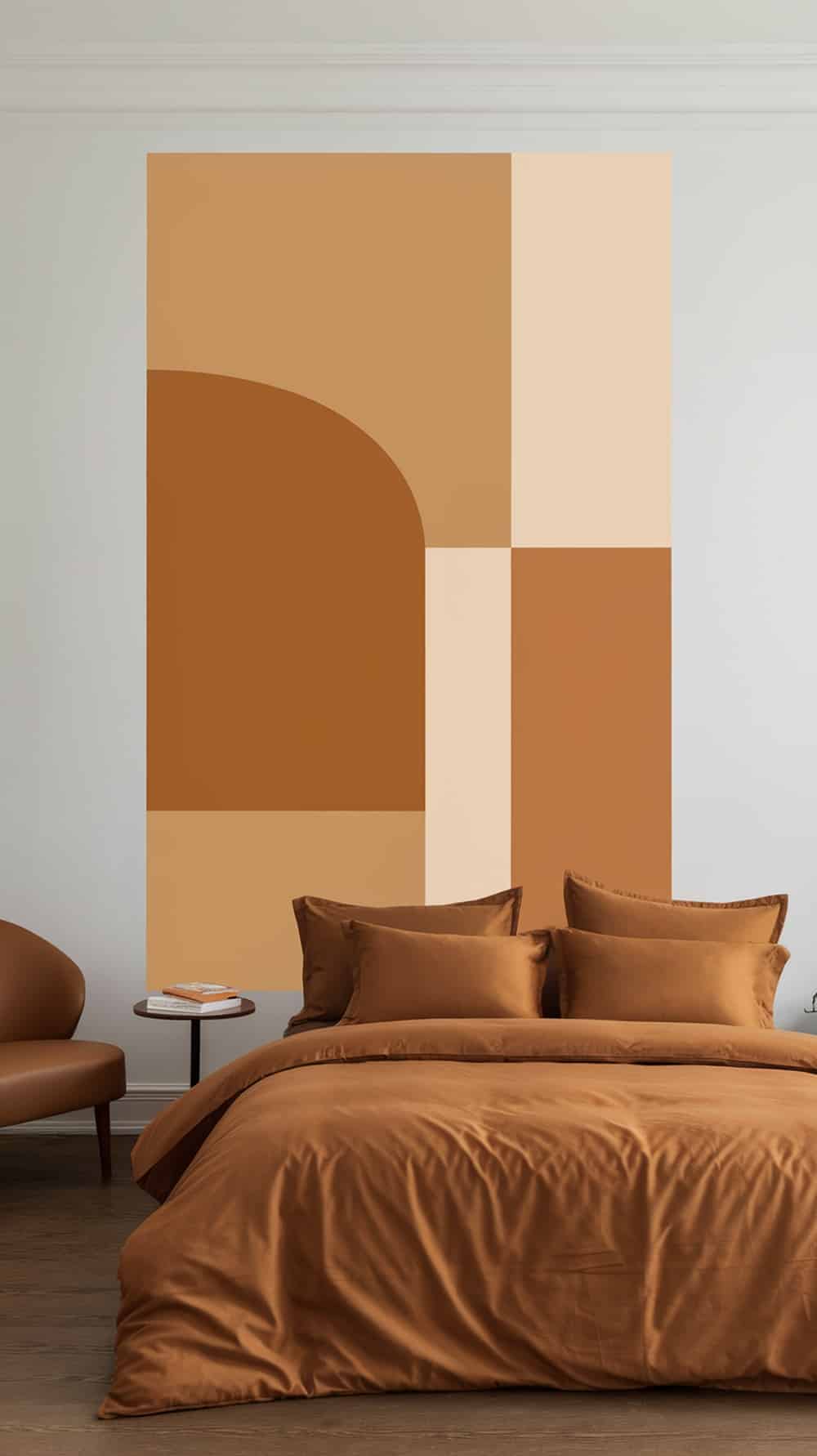 A minimalist caramel bedroom featuring geometric wall art and matching bedding.