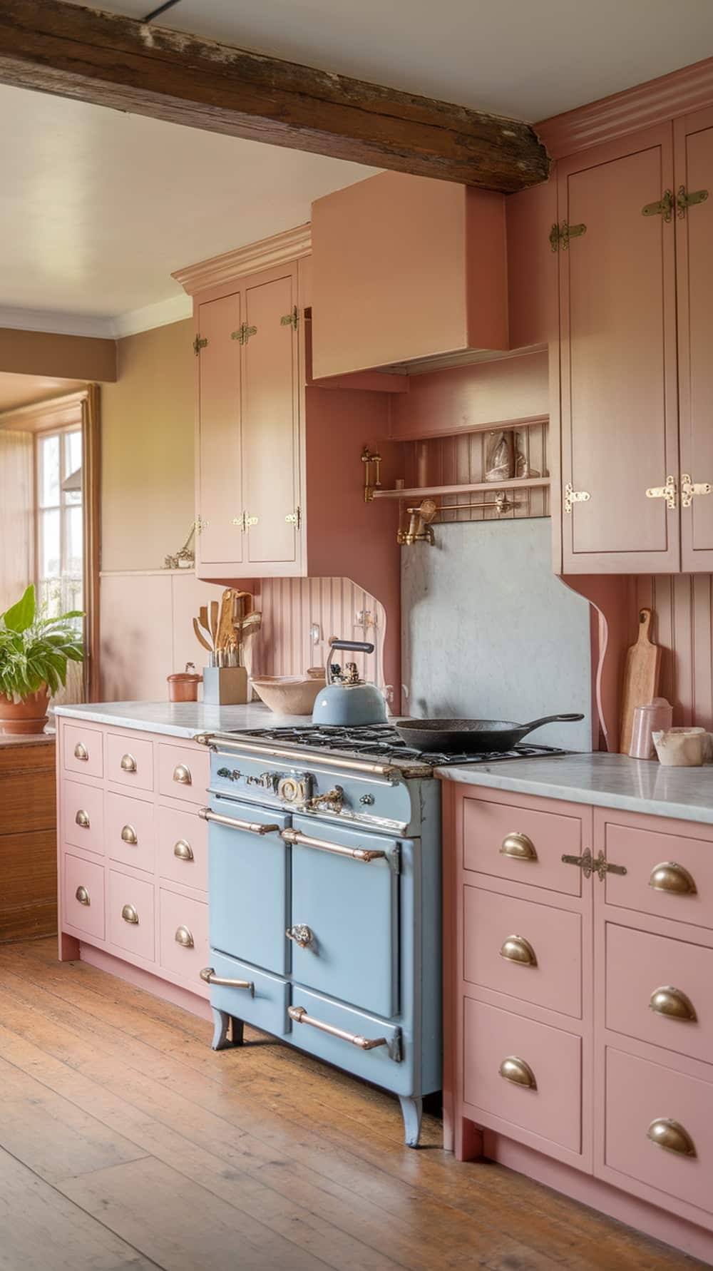 A cozy cottage kitchen featuring blush pink cabinets and a vintage blue stove.