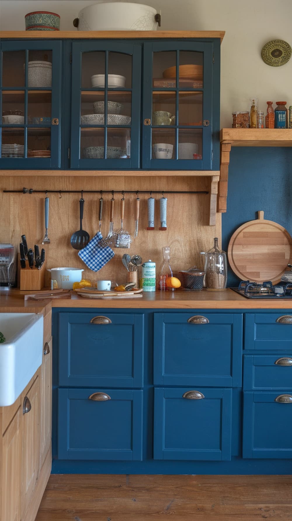A kitchen featuring indigo cabinets and natural wood elements.